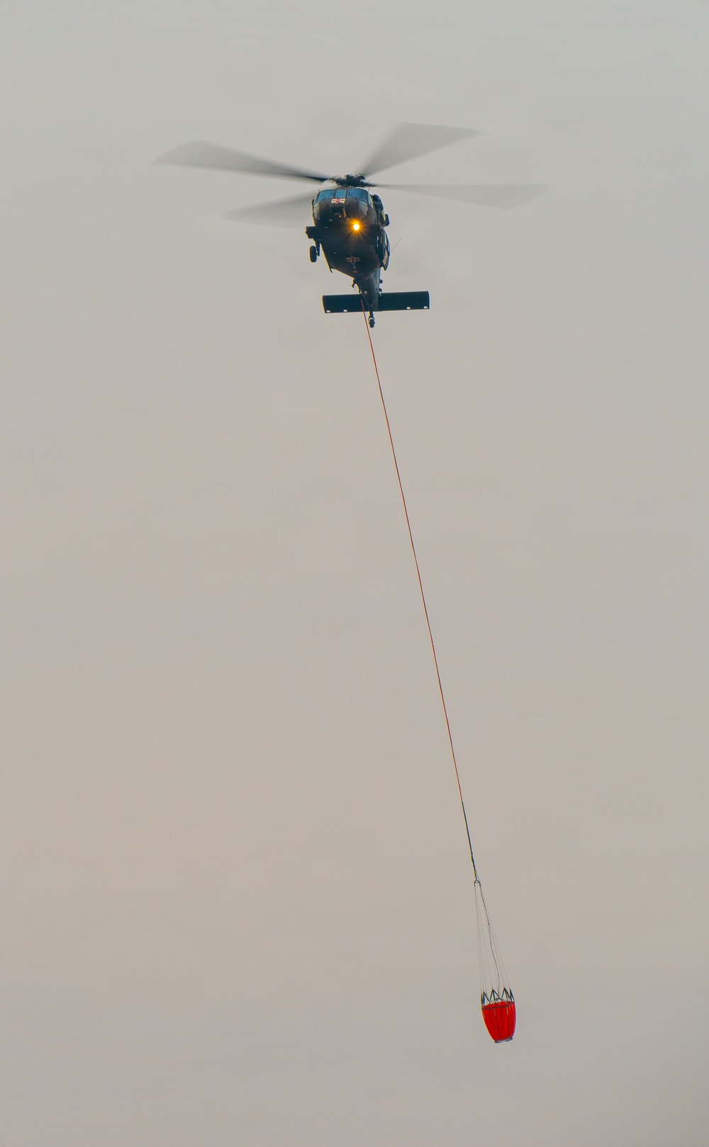 Oregon Guard aircrews begin water bucket missions on eastern Oregon wildfires