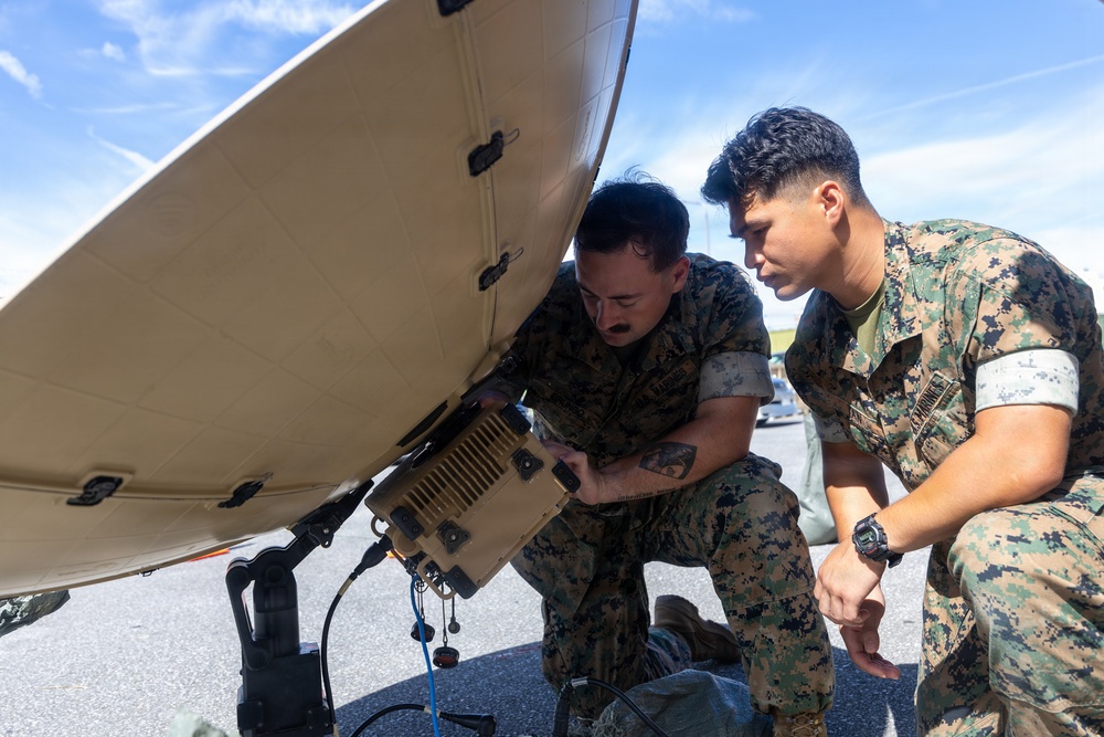 MWCS-18 Marines set up communication equipment