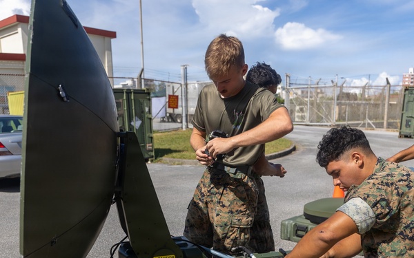 MWCS-18 Marines set up communication equipment
