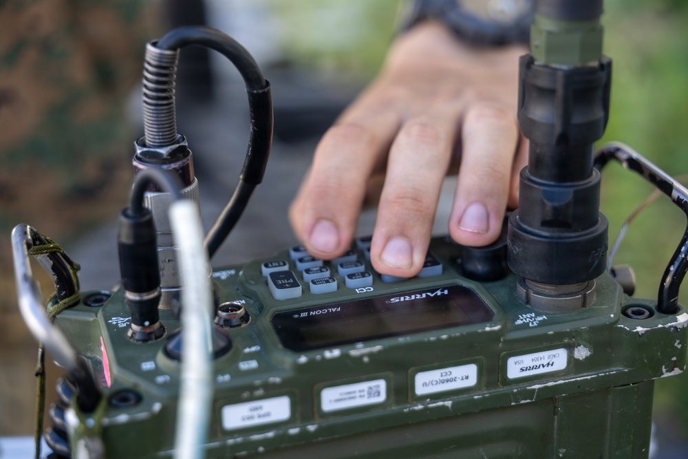 MWCS-18 Marines set up communication equipment