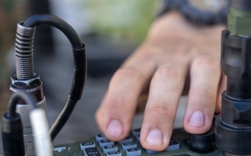 MWCS-18 Marines set up communication equipment