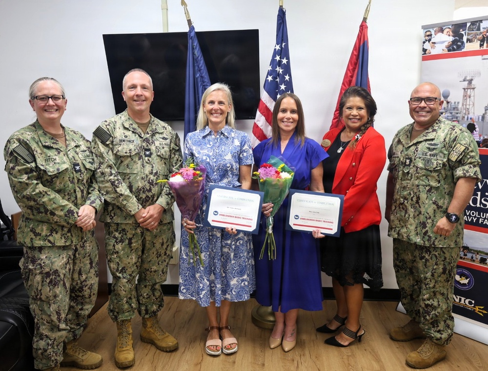 Katie Wrolstad and Cara Cole pose for a photo as the newly appointed command ombudsmen at U.S. Navy Medicine Readiness and Training Command Guam
