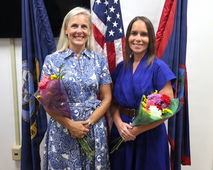 Katie Wrolstad and Cara Cole pose for a photo as the newly appointed command ombudsmen at U.S. Navy Medicine Readiness and Training Command Guam