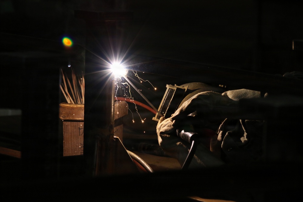 U.S. Naval Ship Repair Facility and Japan Regional Maintenance Center (SRF-JRMC) Master Labor Agreement employee conducts welding operations