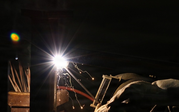 U.S. Naval Ship Repair Facility and Japan Regional Maintenance Center (SRF-JRMC) Master Labor Agreement employee conducts welding operations