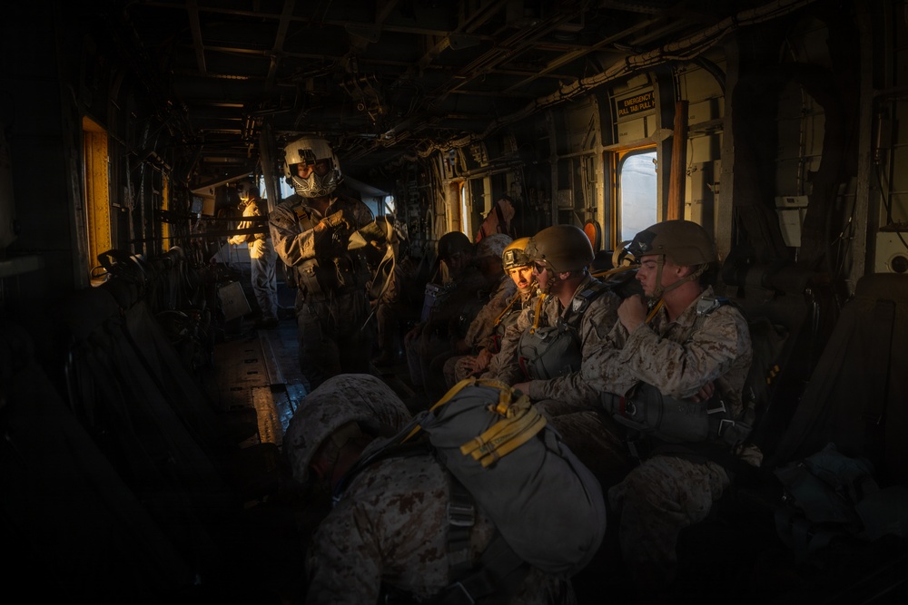Marines with Combat Logistics Battalion conduct a personnel jump during SLTE 4-26