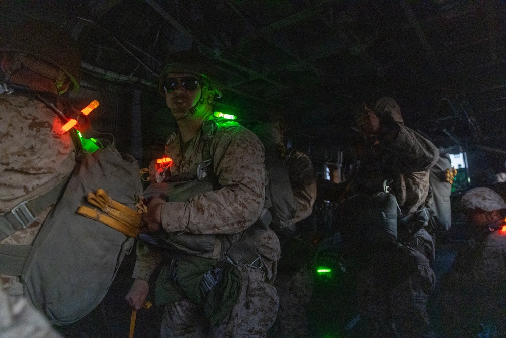Marines with Combat Logistics Battalion conduct a personnel jump during SLTE 4-26