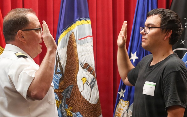 Navy Captain administers Oath of Enlistment for Son on Last Day of Navy Career