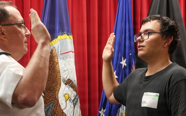 Navy Captain administers Oath of Enlistment for Son on Last Day of Navy Career