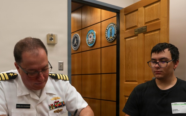 Navy Captain administers Oath of Enlistment for Son on Last Day of Navy Career