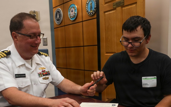 Navy Captain administers Oath of Enlistment for Son on Last Day of Navy Career