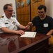 Navy Captain administers Oath of Enlistment for Son on Last Day of Navy Career