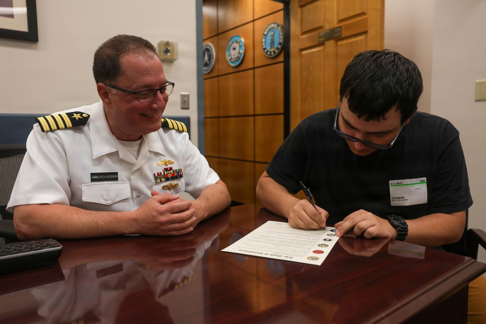 Navy Captain administers Oath of Enlistment for Son on Last Day of Navy Career
