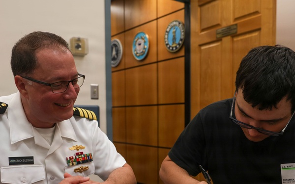 Navy Captain administers Oath of Enlistment for Son on Last Day of Navy Career