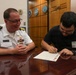Navy Captain administers Oath of Enlistment for Son on Last Day of Navy Career