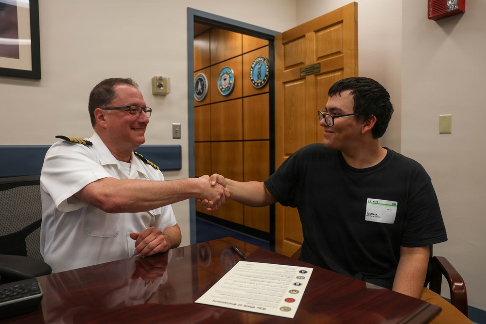 Navy Captain administers Oath of Enlistment for Son on Last Day of Navy Career