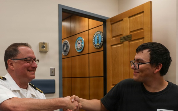 Navy Captain administers Oath of Enlistment for Son on Last Day of Navy Career
