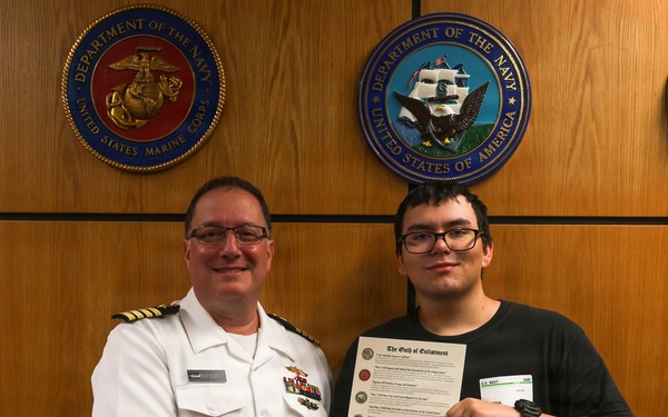 Navy Captain administers Oath of Enlistment for Son on Last Day of Navy Career