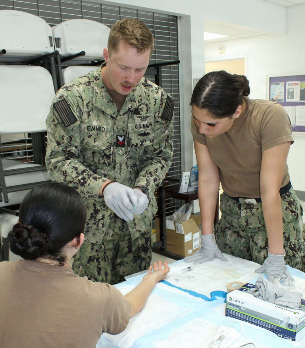 Corpsmen Rehearse Intravenous Access During Tactical Training