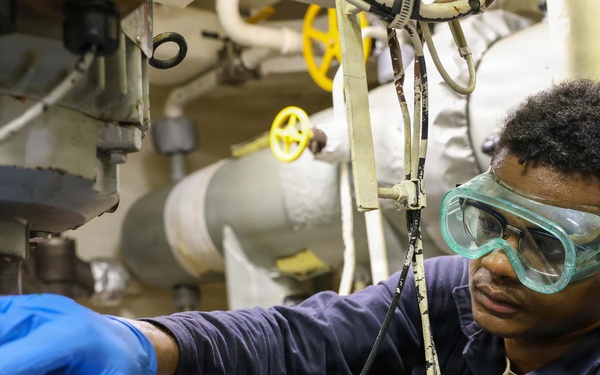 John Finn Inspects Oil Levels
