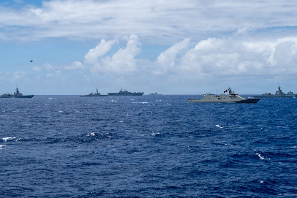 Multinational ships sail in formation during RIMPAC 2026