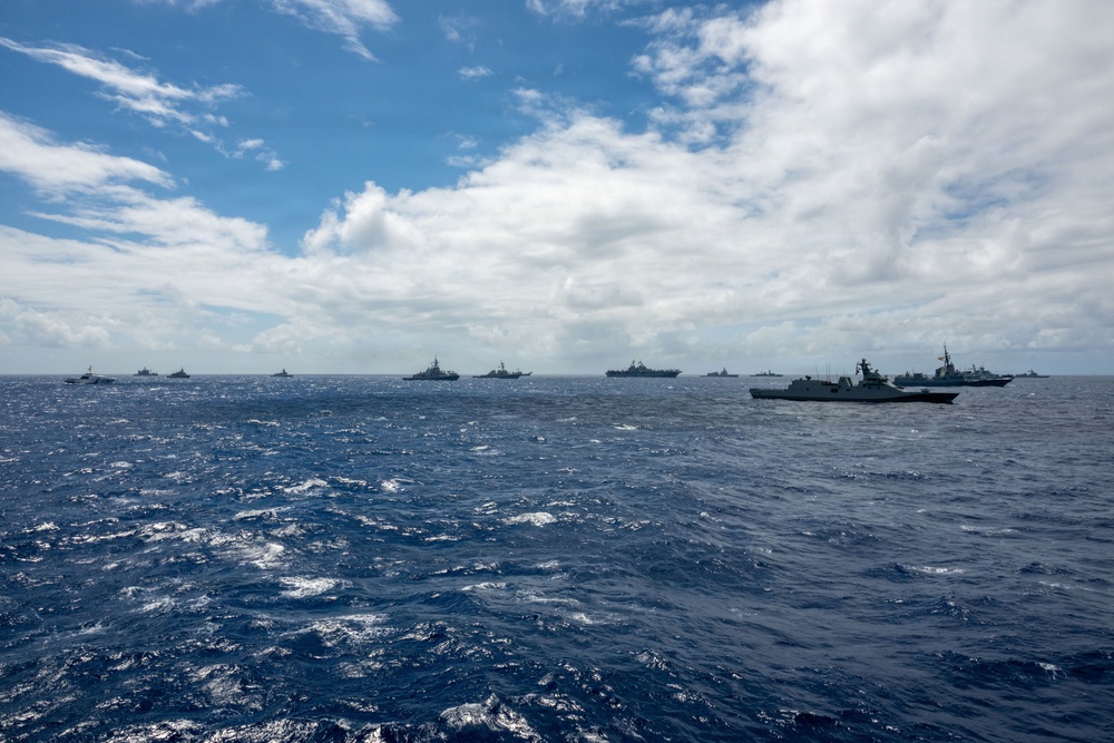 Multinational ships sail in formation during RIMPAC 2026