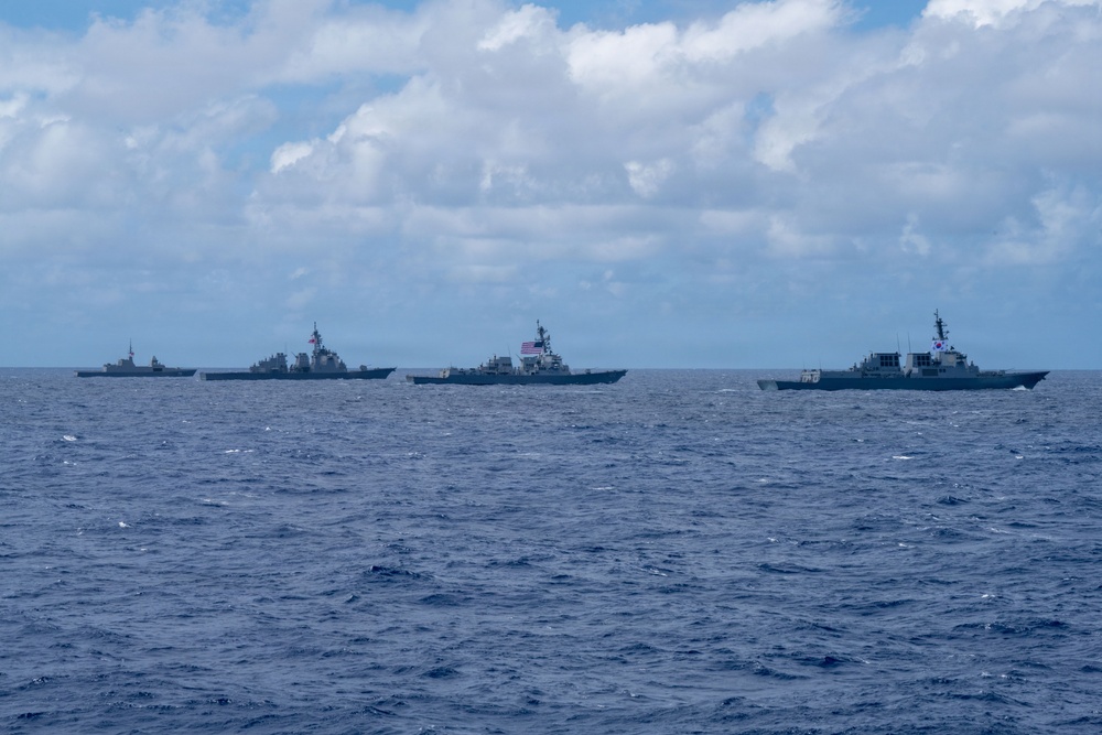 Multinational ships sail in formation during RIMPAC 2026