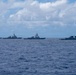 Multinational ships sail in formation during RIMPAC 2026