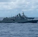Multinational ships sail in formation during RIMPAC 2026