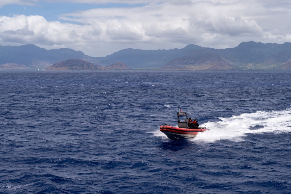 U.S. Coast Guard over-the-horizon small boat sails in front of O'ahu during RIMPAC 2026