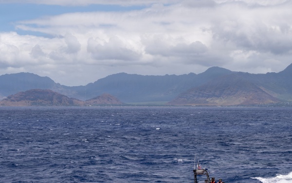 U.S. Coast Guard over-the-horizon small boat sails in front of O'ahu during RIMPAC 2026