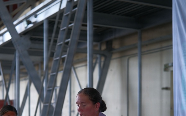 U.S. Service Members attend JRSOI brief for PANAMAX