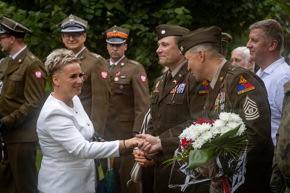 U.S. Army Soldiers participate at a memorial ceremony in Poland