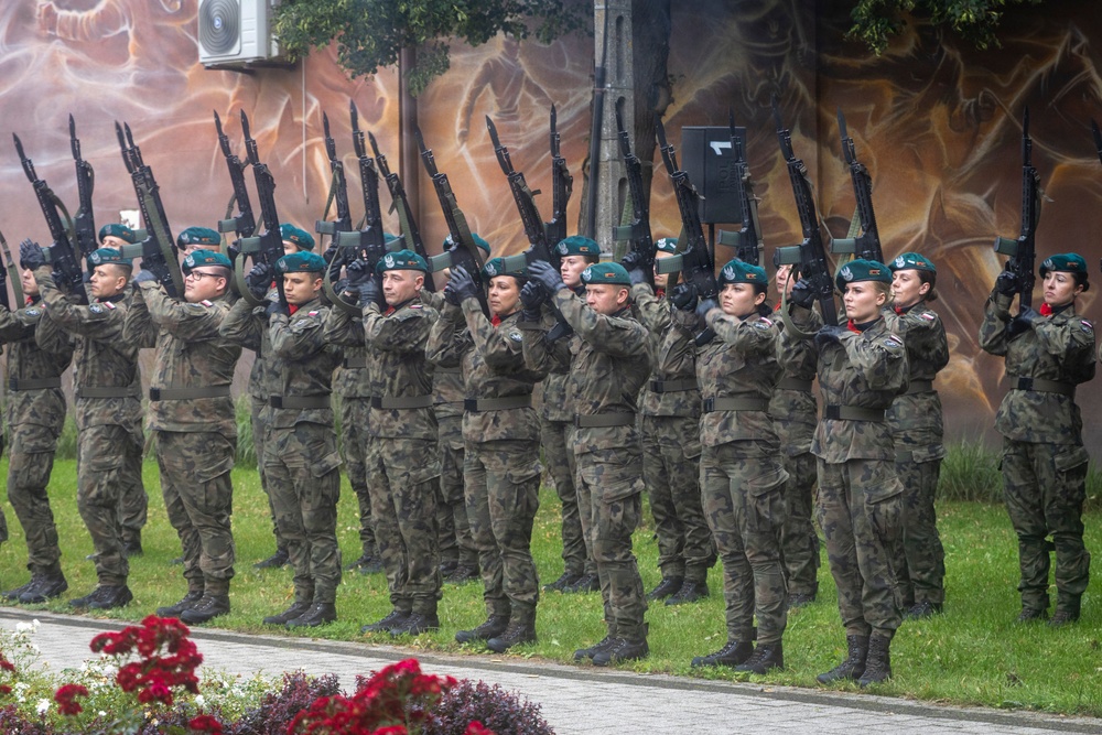 U.S. Army Soldiers participate at a memorial ceremony in Poland