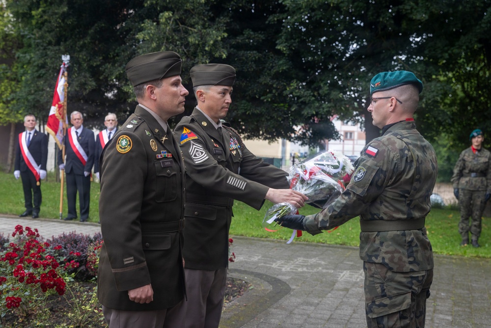 U.S. Army Soldiers participate at a memorial ceremony in Poland