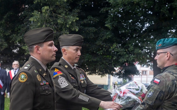 U.S. Army Soldiers participate at a memorial ceremony in Poland