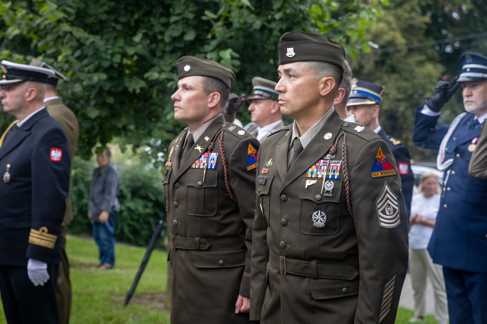 U.S. Army Soldiers participate at a memorial ceremony in Poland