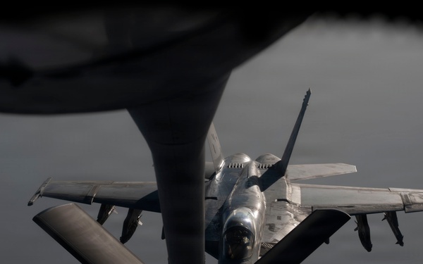 KC-135 refuels U.S. Navy fighters in the CENTCOM area of responsibility