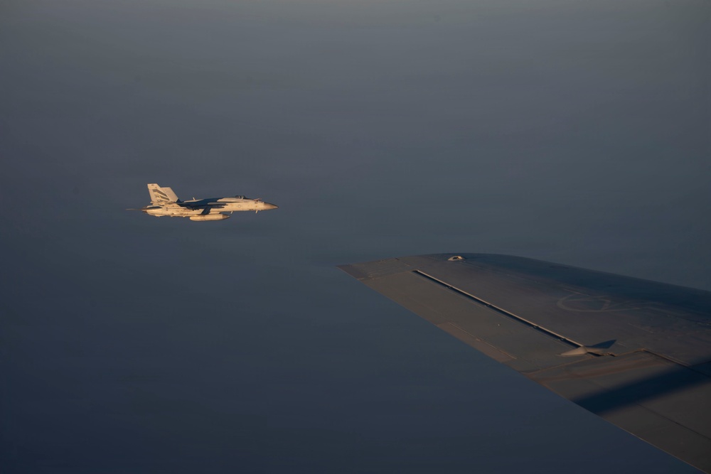 KC-135 refuels U.S. Navy fighters in the CENTCOM area of responsibility