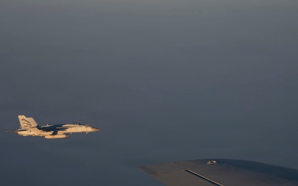 KC-135 refuels U.S. Navy fighters in the CENTCOM area of responsibility