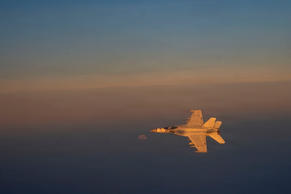 KC-135 refuels U.S. Navy fighters in the CENTCOM area of responsibility