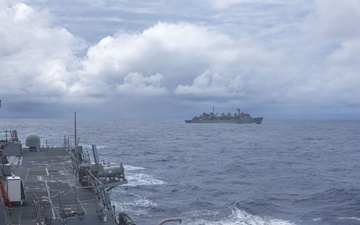 USS Mustin conducts replenishment-at-sea with USNS Arctic