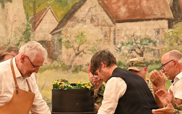 Leadership gathered on stage to tap the festival beer keg