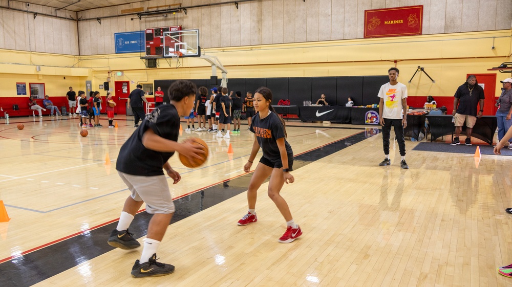 Youth basketball camp led by Christain Taylor, a professional international basketball player, at the Semper Fit base gym aboard Marine Corps Logistics Base Barstow, California, August 1.