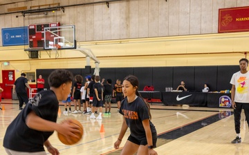 Youth basketball camp led by Christain Taylor, a professional international basketball player, at the Semper Fit base gym aboard Marine Corps Logistics Base Barstow, California, August 1.