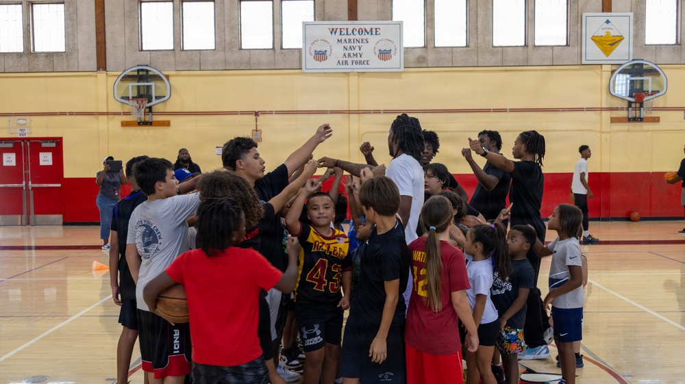 Youth basketball camp led by Christain Taylor, a professional international basketball player, at the Semper Fit base gym aboard Marine Corps Logistics Base Barstow, California, August 1.