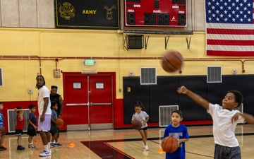 Youth basketball camp led by Christain Taylor, a professional international basketball player, at the Semper Fit base gym aboard Marine Corps Logistics Base Barstow, California, August 1.