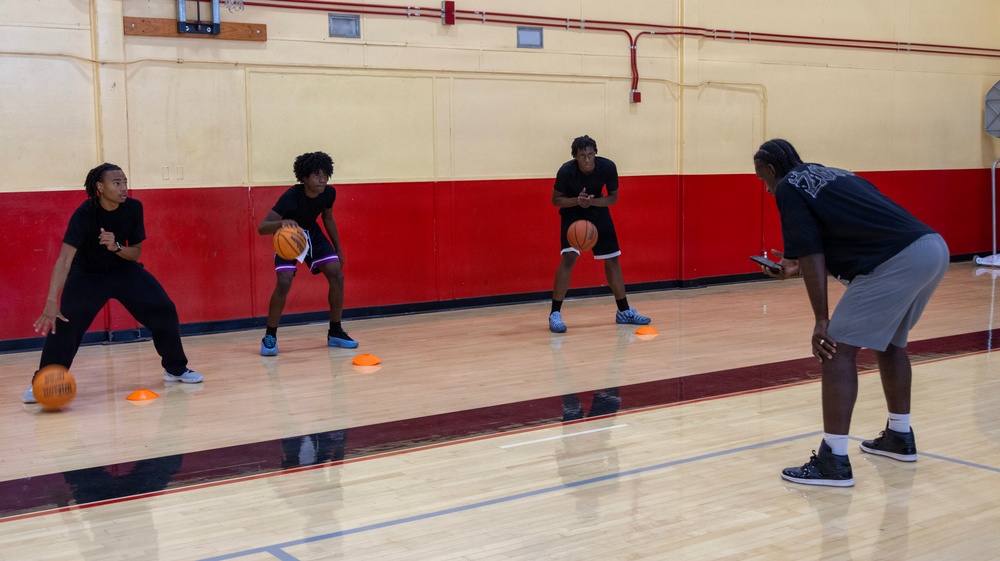 Youth basketball camp led by Christain Taylor, a professional international basketball player, at the Semper Fit base gym aboard Marine Corps Logistics Base Barstow, California, August 1.