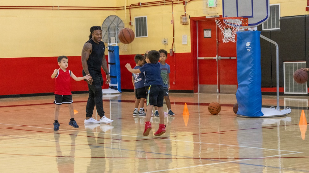 Youth basketball camp led by Christain Taylor, a professional international basketball player, at the Semper Fit base gym aboard Marine Corps Logistics Base Barstow, California, August 1.