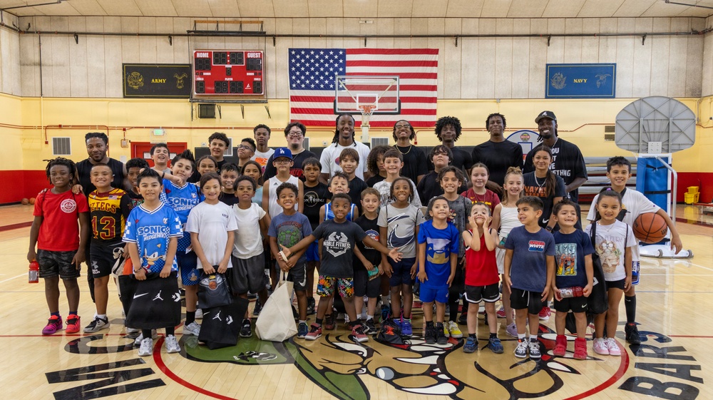 Youth basketball camp led by Christain Taylor, a professional international basketball player, at the Semper Fit base gym aboard Marine Corps Logistics Base Barstow, California, August 1.